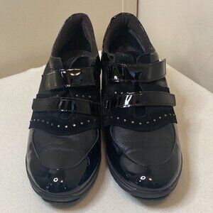 Sleek Black Patent Leather Sneakers